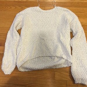 white and gold sweater